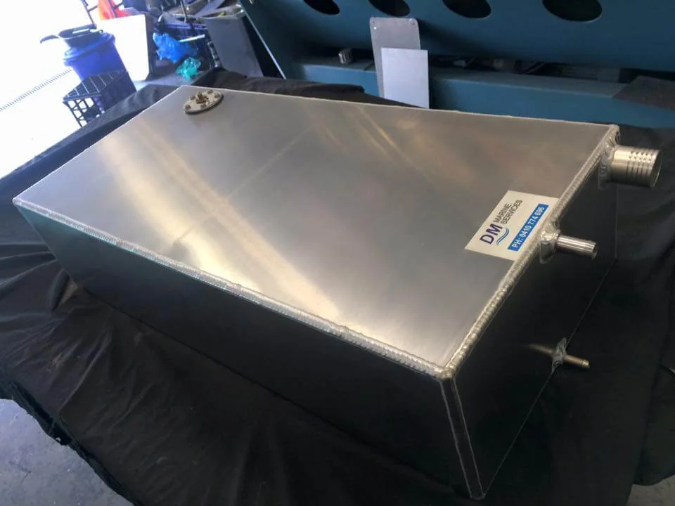 Alloy tank fitted into a boat floor cavity